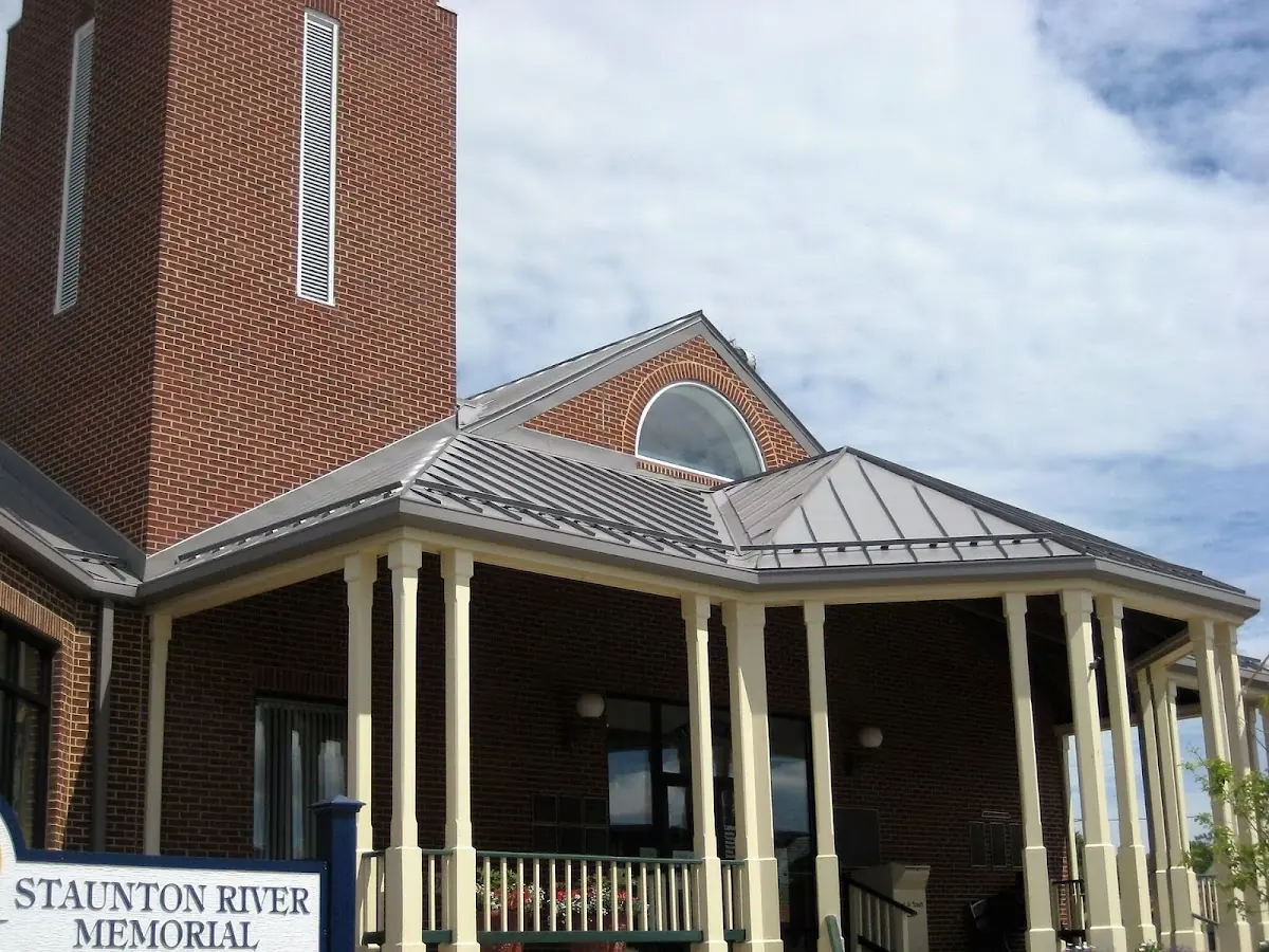 Skilled roofing craftsmen working on a residential roof in Millwood
